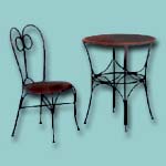 Wrought iron chair and table combination.